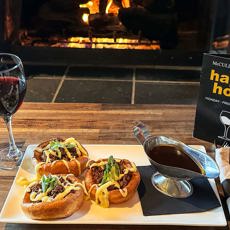 Enjoy our New Yorkies with a Glass of Red Wine